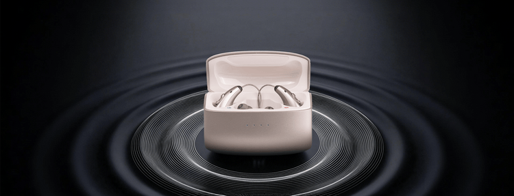 Wireless hearing aids in a charging case on a dark background with water ripple effect